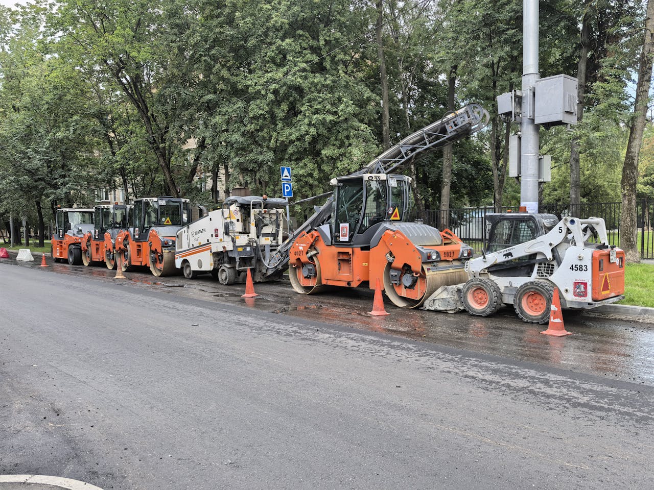 about-04 Heavy machinery lined up for road construction in a city.